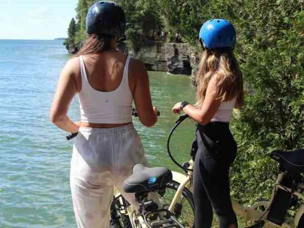 a couple of people that are standing in the water