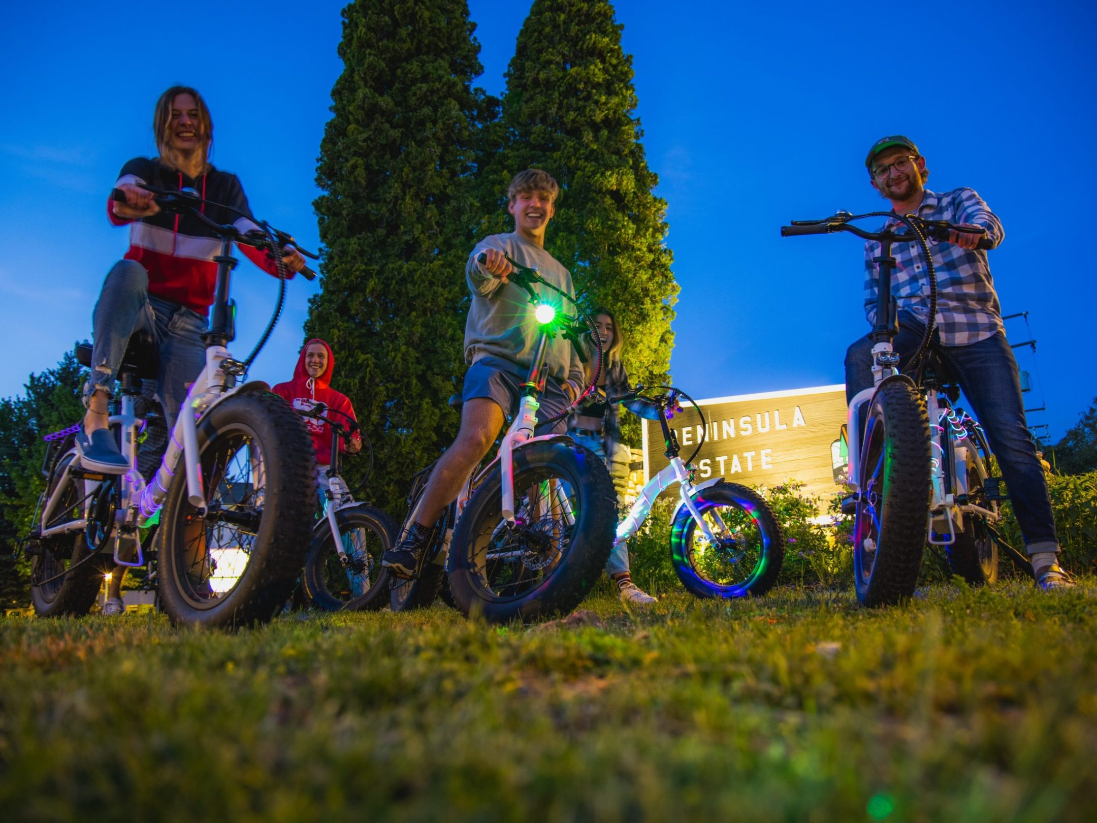a group of people riding on the back of a motorcycle