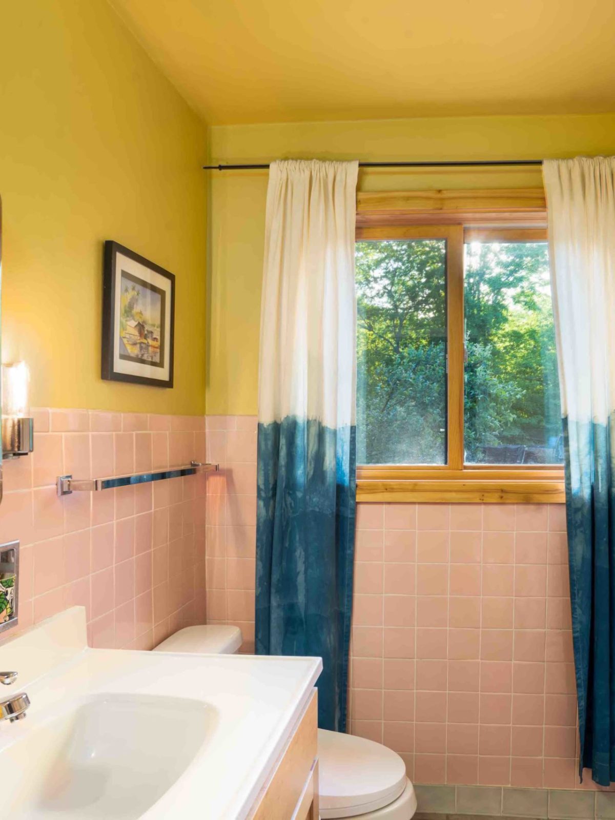 a room with a sink and a mirror