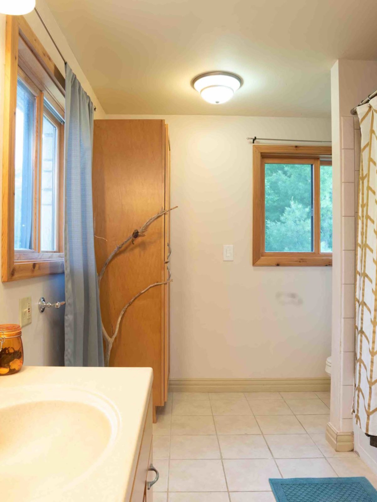 a room with a sink and a mirror