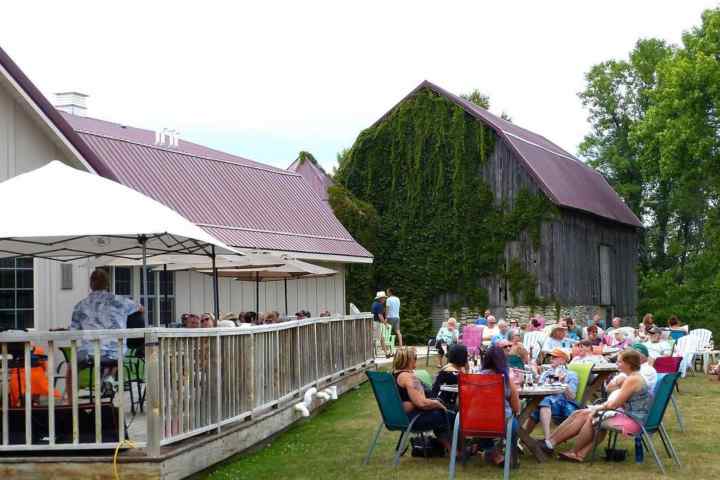 a group of people sitting in a yard