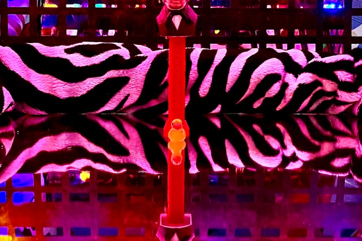 a group of people on a stage in front of a store